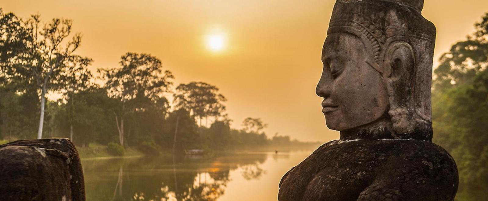 Buddha is shown over a body of water in Angkor Wat, where Projects Abroad volunteers visit and educate themselves on Khmer History