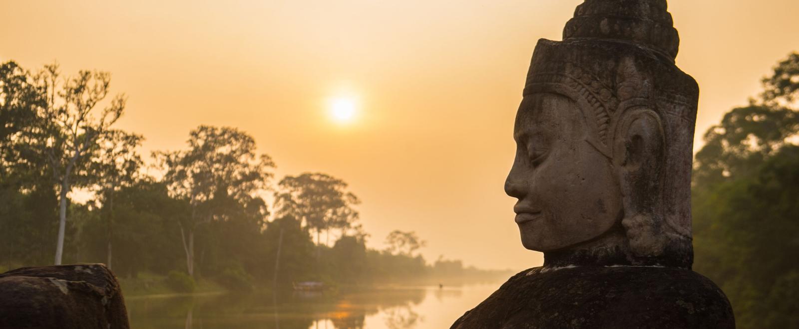Buddha is shown over a body of water in Angkor Wat, where Projects Abroad volunteers visit and educate themselves on Khmer history.