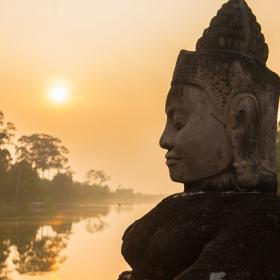 Buddha is shown over a body of water in Angkor Wat, where Projects Abroad volunteers visit and educate themselves on Khmer history.