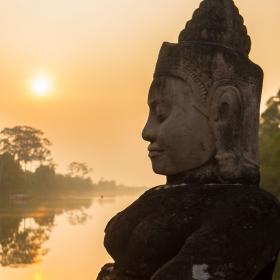 Buddha is shown over a body of water in Angkor Wat, where Projects Abroad volunteers visit and educate themselves on Khmer history.