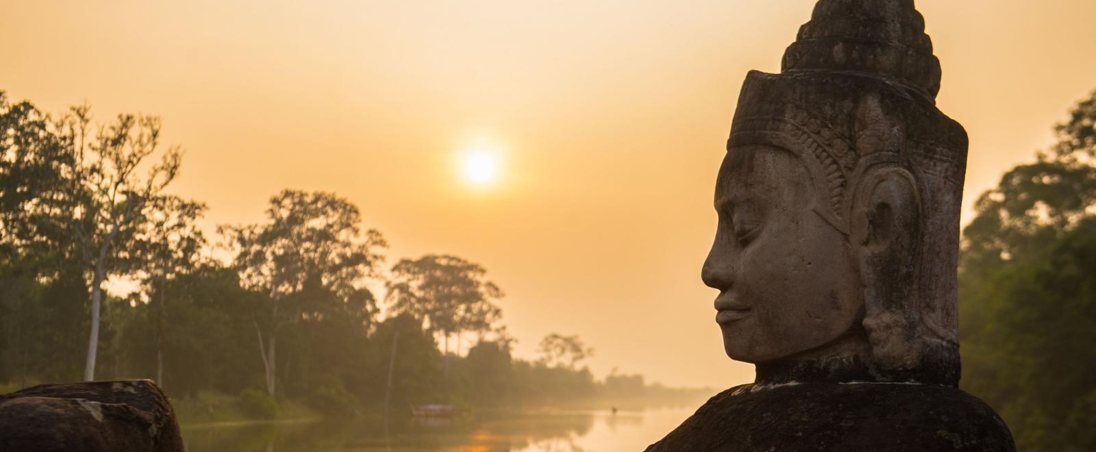 Buddha is shown over a body of water in Angkor Wat, where Projects Abroad volunteers visit and educate themselves on Khmer history.