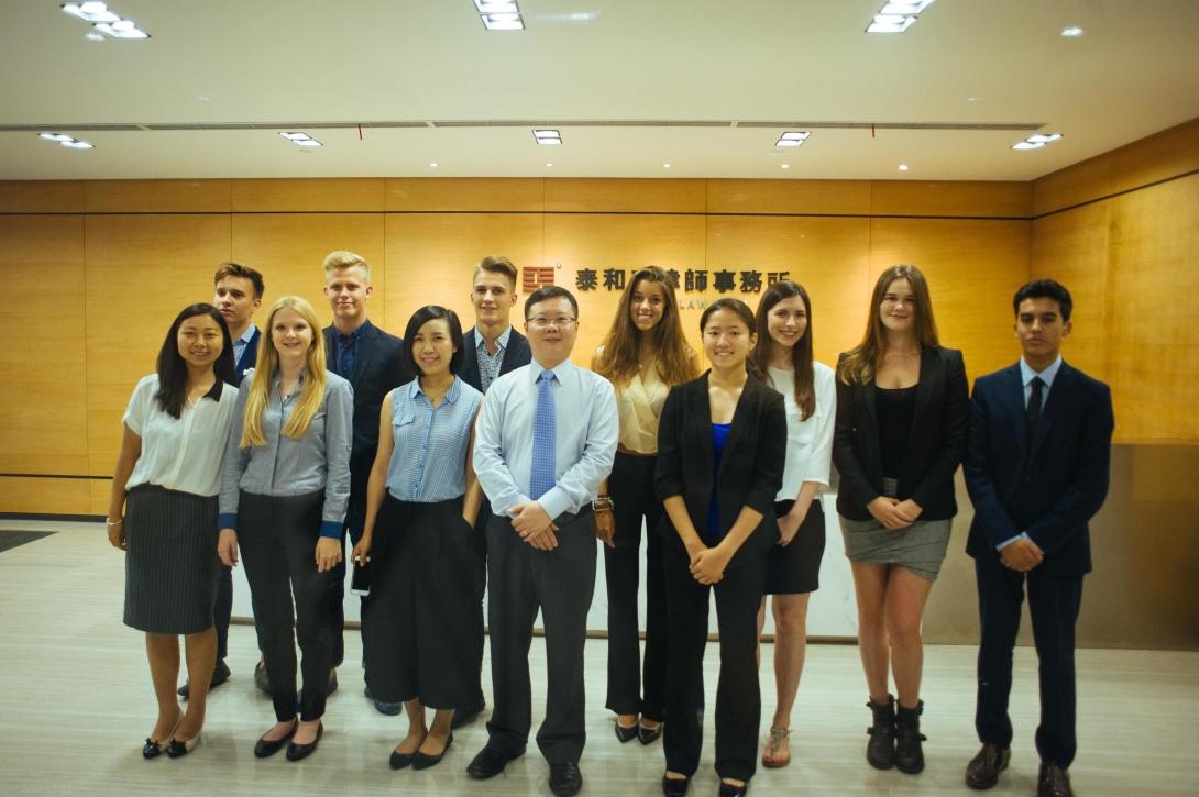 Law internship volunteers attending a workshop in China for high school students.