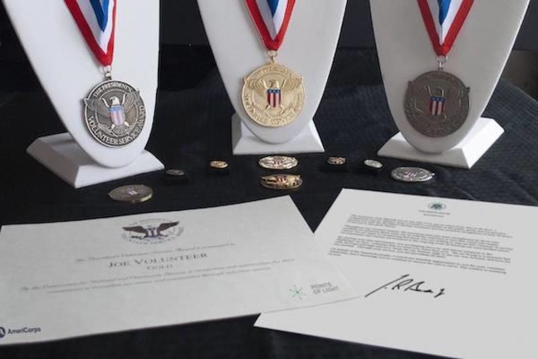 Presidential Service Volunteer Award medals, pins, and certificate