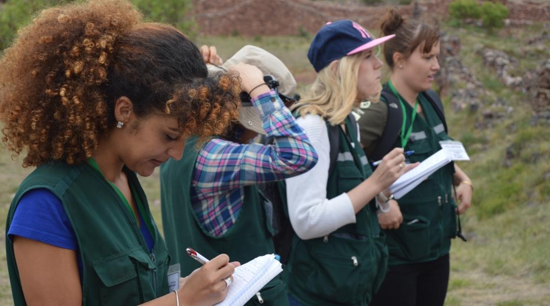 Volunteers take notes during a dig on one of our Archaeology opportunities abroad.
