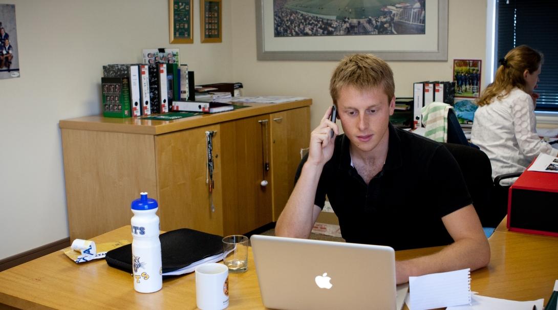 An intern working in an office on one of our international business internships.