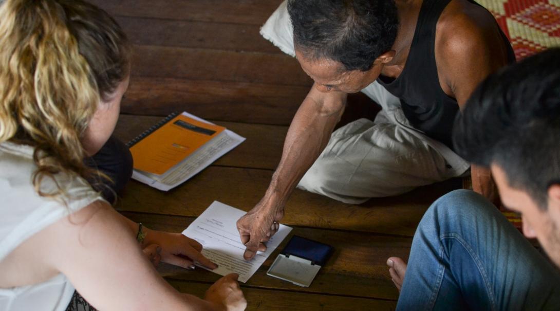 A local entrepreneur receives a loan on one of our Micro-finance internships abroad.