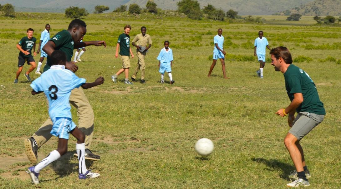 Volunteers and local students playing football on one of our Sports volunteering opportunities.