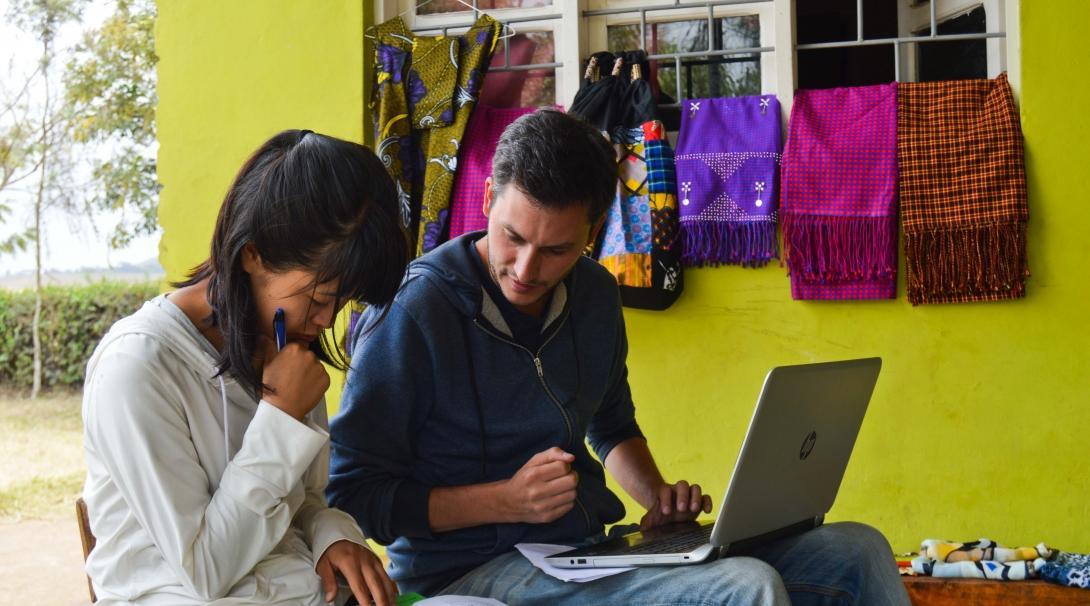 Projects Abroad interns edit a spreadsheet as part of their internship work overseas. 