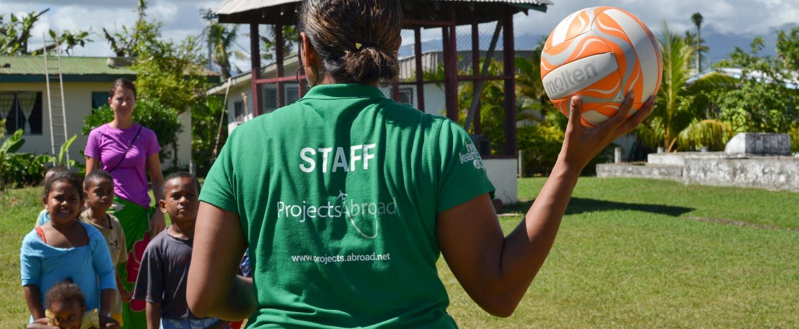 A local Projects Abroad staff member is taking care of the safety of the volunteers and kids in Fiji.