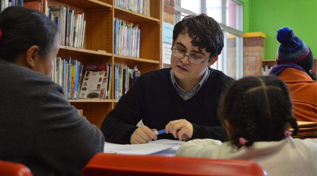 A Law and Human Rights intern assists a South African family on his work abroad programme.
