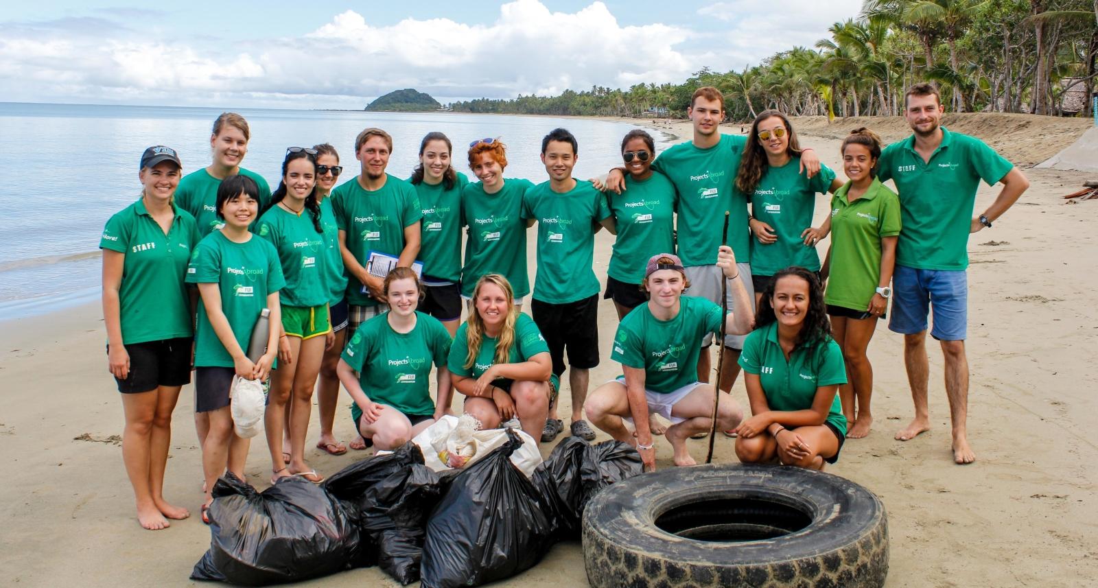 rojects Abroad volunteers pose after a successful beach clean up in Fiji