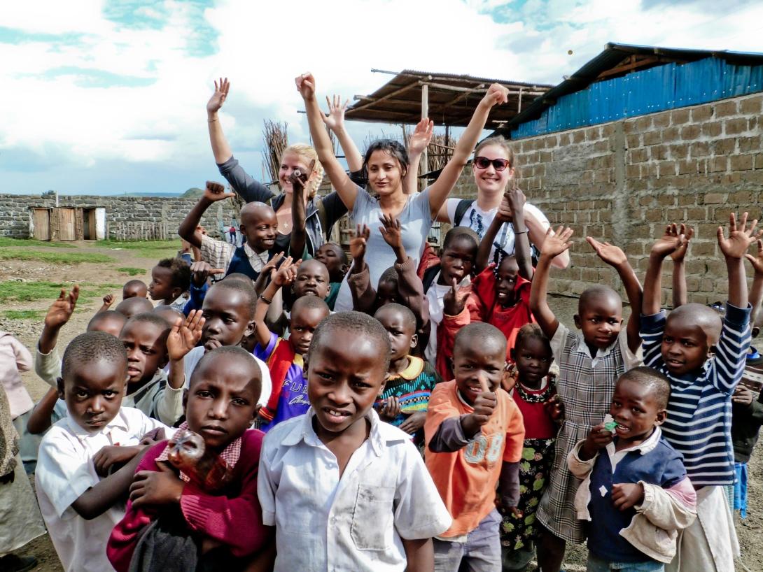 Care volunteers with school children in Africa
