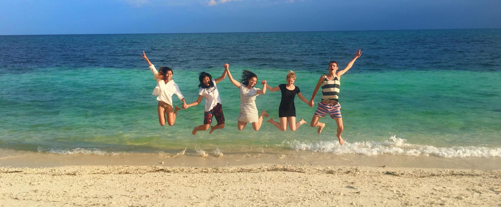 Projects Abroad volunteers having fun on a beach in the Philippines.